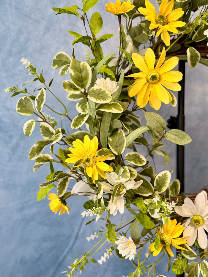 Close-up of white & yellow daisy wreath detail from Magnolias Home Decor