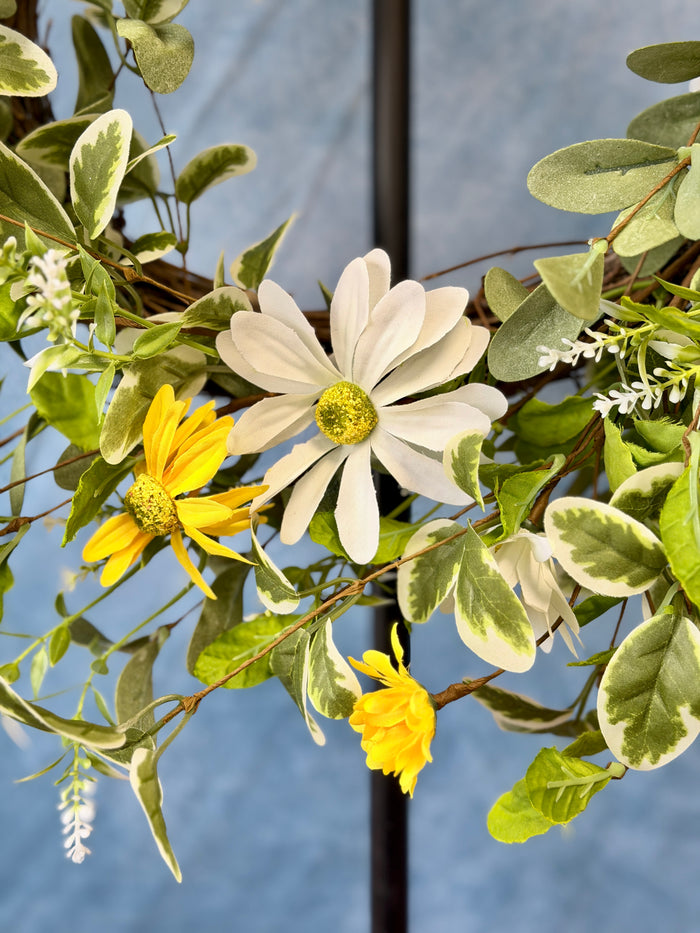 White & yellow daisy wreath styled for Spring home decor from Magnolias Home Decor