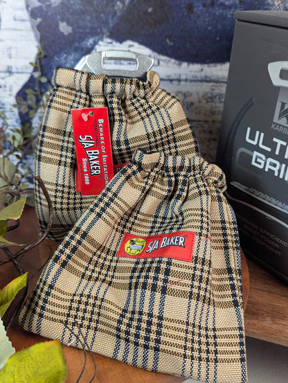 plaid english stirrup covers with the 5a baker red tag logo