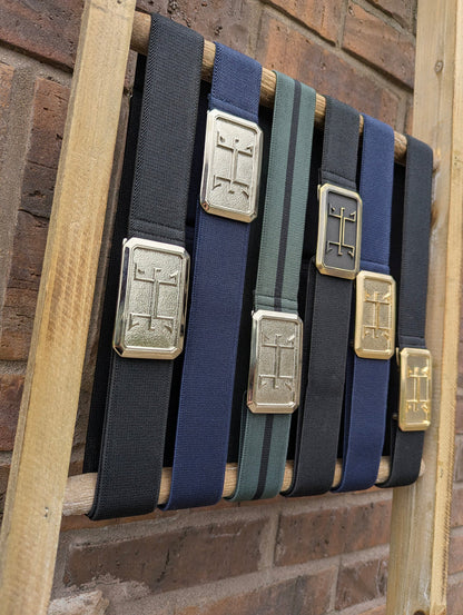 huston ellany signature belt collection displayed on a ladder next to a brick wall