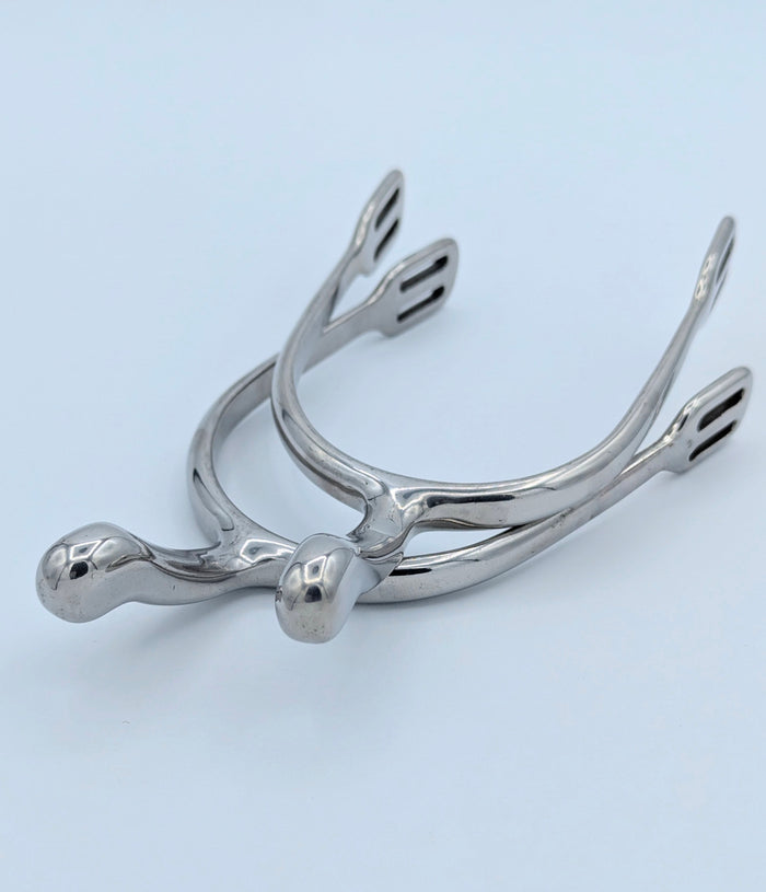 Pair of stainless steel swan‑neck spurs displayed on a light background, showing the curved neck and strap slots.