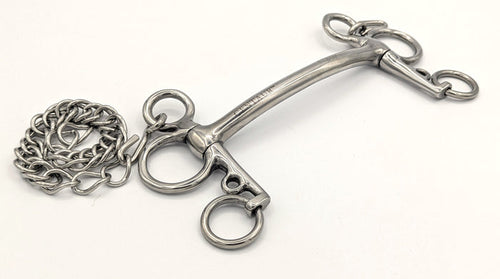 silver stainless curved mullen tom thumb pelham bit on a white background with a curled curb chain.