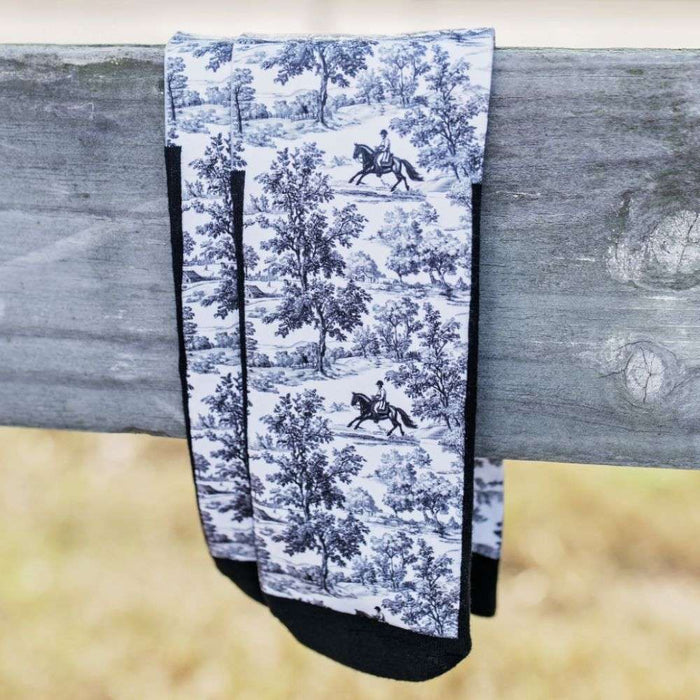 red barn socks countryside canter black and white equestrian tall socks on a wooden fence