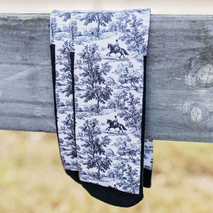 red barn socks countryside canter black and white equestrian tall socks on a wooden fence