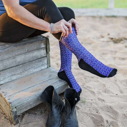 red barn socks snaffle chic paddock boots on a female equestrian
