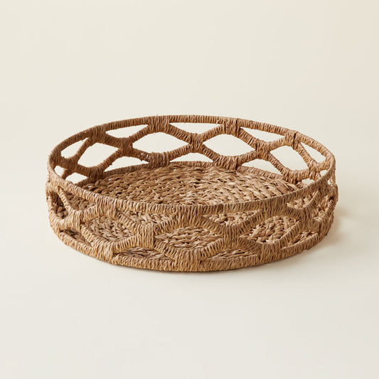 Handwoven round bankuan tray with an intricate texture.