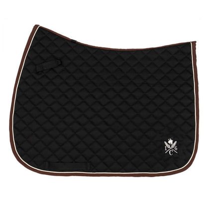 Black quilted jumper saddle pad with ivory piping, black binding, and ivory 16C crest