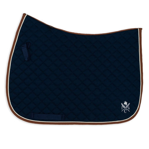 Navy blue quilted saddle pad with cognac binding and cream piping  on a white background