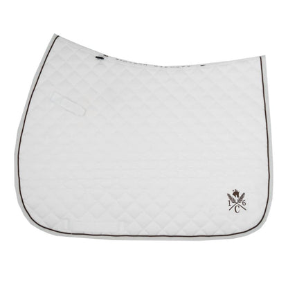 a white sixteen cypress daily sport saddle pad with hickory piping and embroidered design on a white background