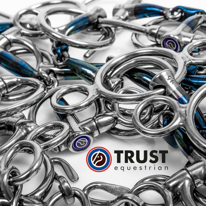 a variety of trust sweet iron blue bits with the trust equestrian logo on a white background