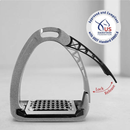TuffRider Tech Safety Stirrup showing grated metal footbed and side‑release safety arm in locked and release positions, approved under USEF GR801.6.